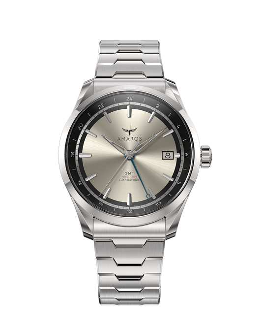 Silver watch with a metallic face on a white background